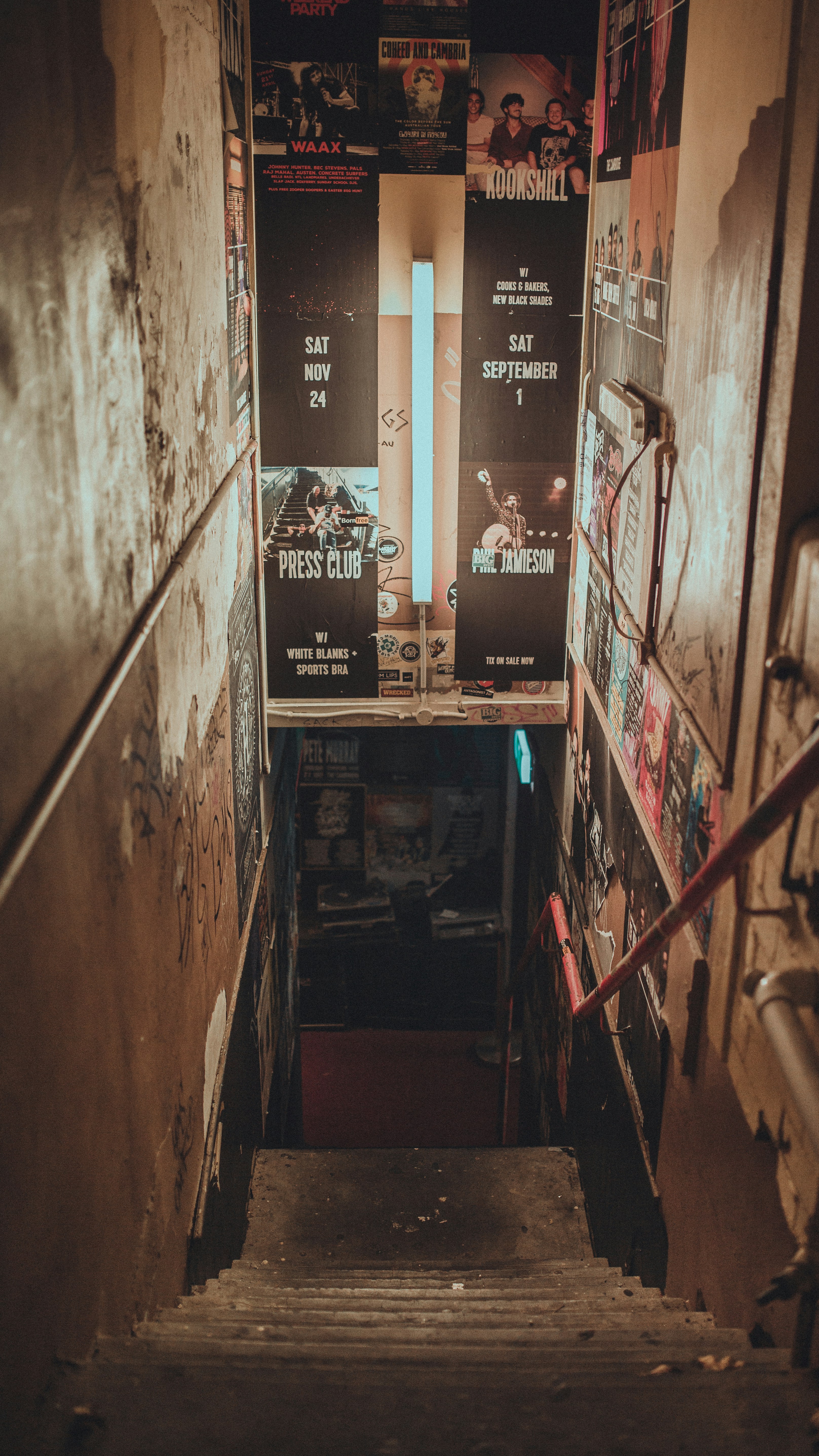 a hallway with posters on the walls