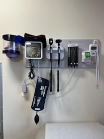 a wall with a wall of electronic devices and a phone on it