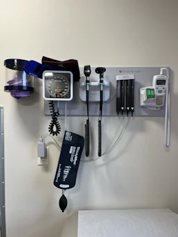 a wall with a wall of electronic devices and a phone on it