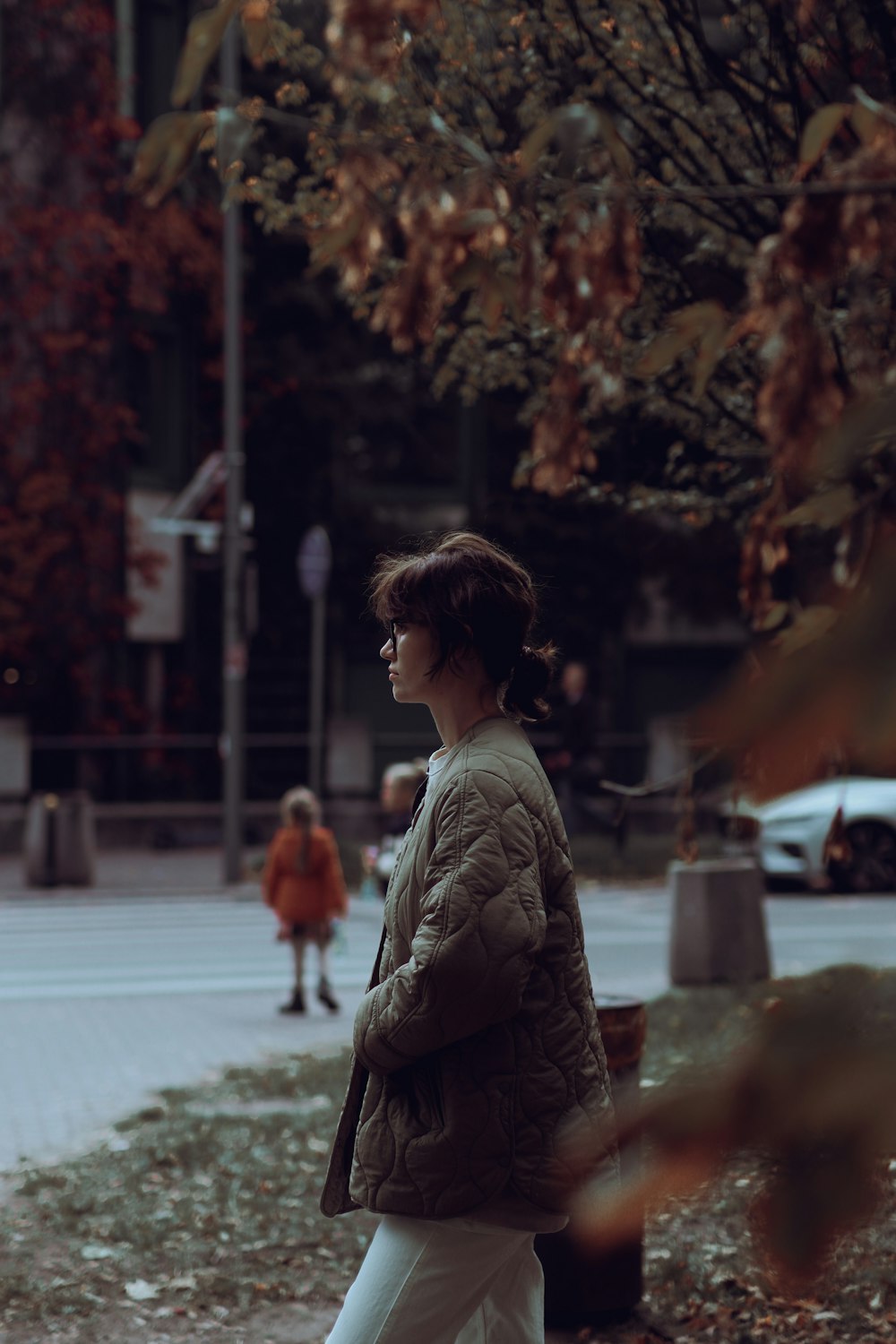 a person walking on a sidewalk