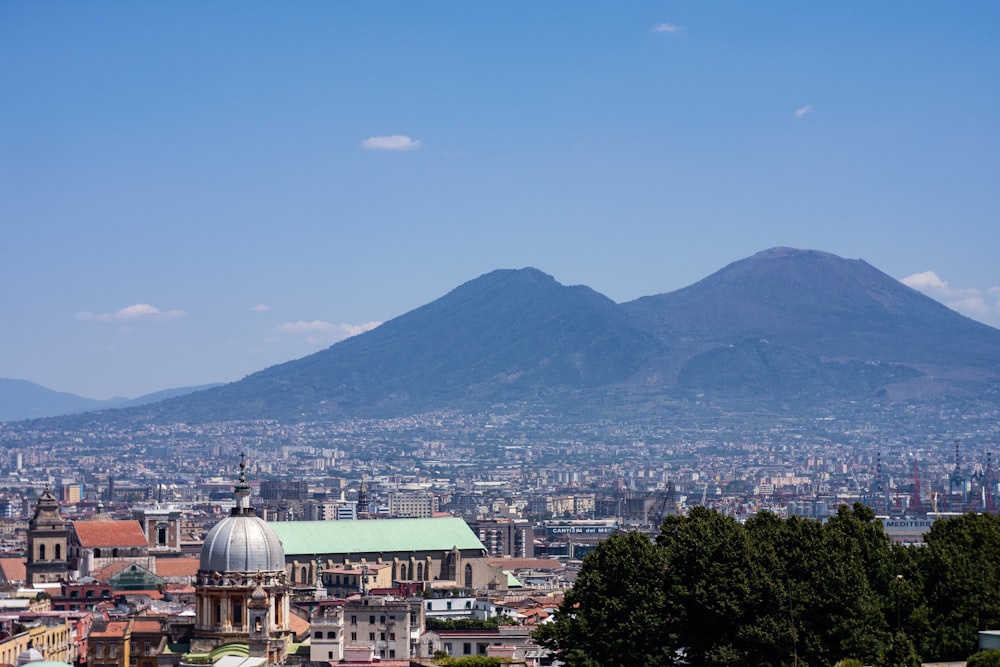 a city with a mountain in the background