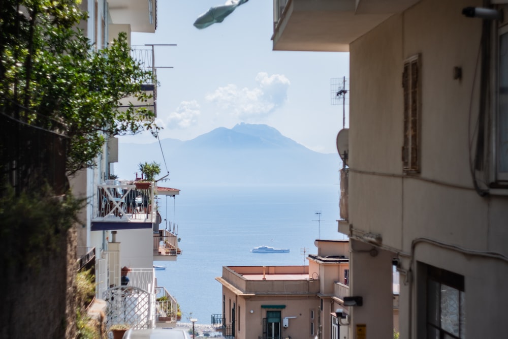 a view of a sea and buildings from a balcony