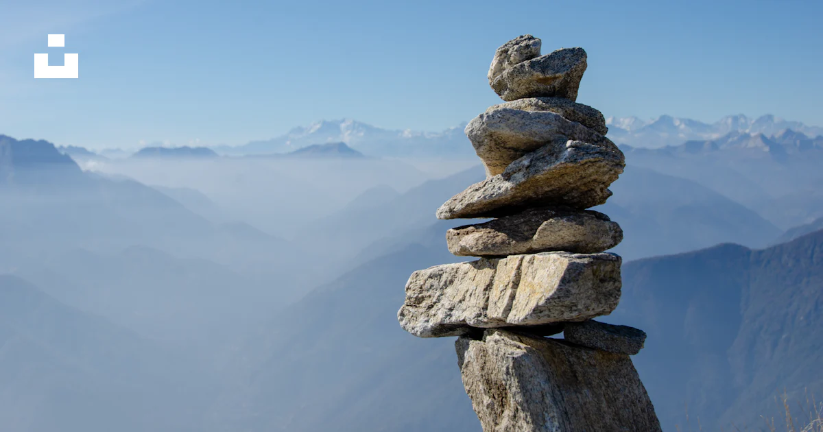 A stack of rocks on a mountain photo – Free Switzerland Image on Unsplash