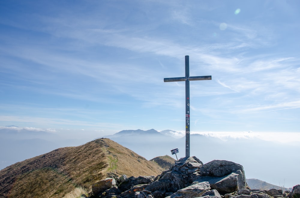 a cross on a mountain