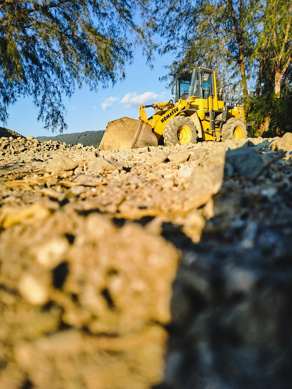 a tractor in a pile of dirt