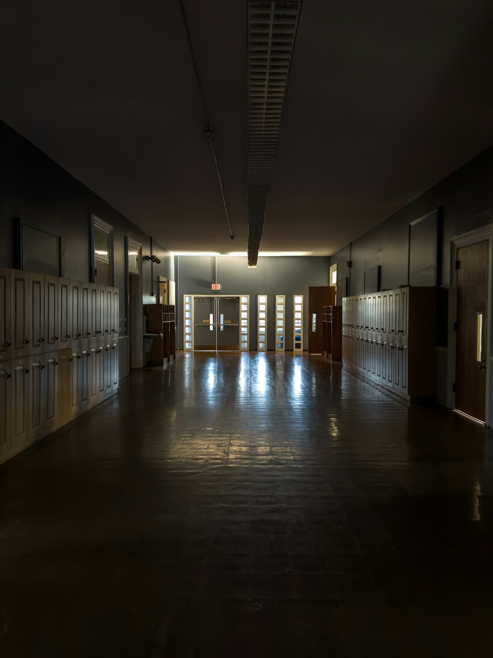 a hallway with doors and windows