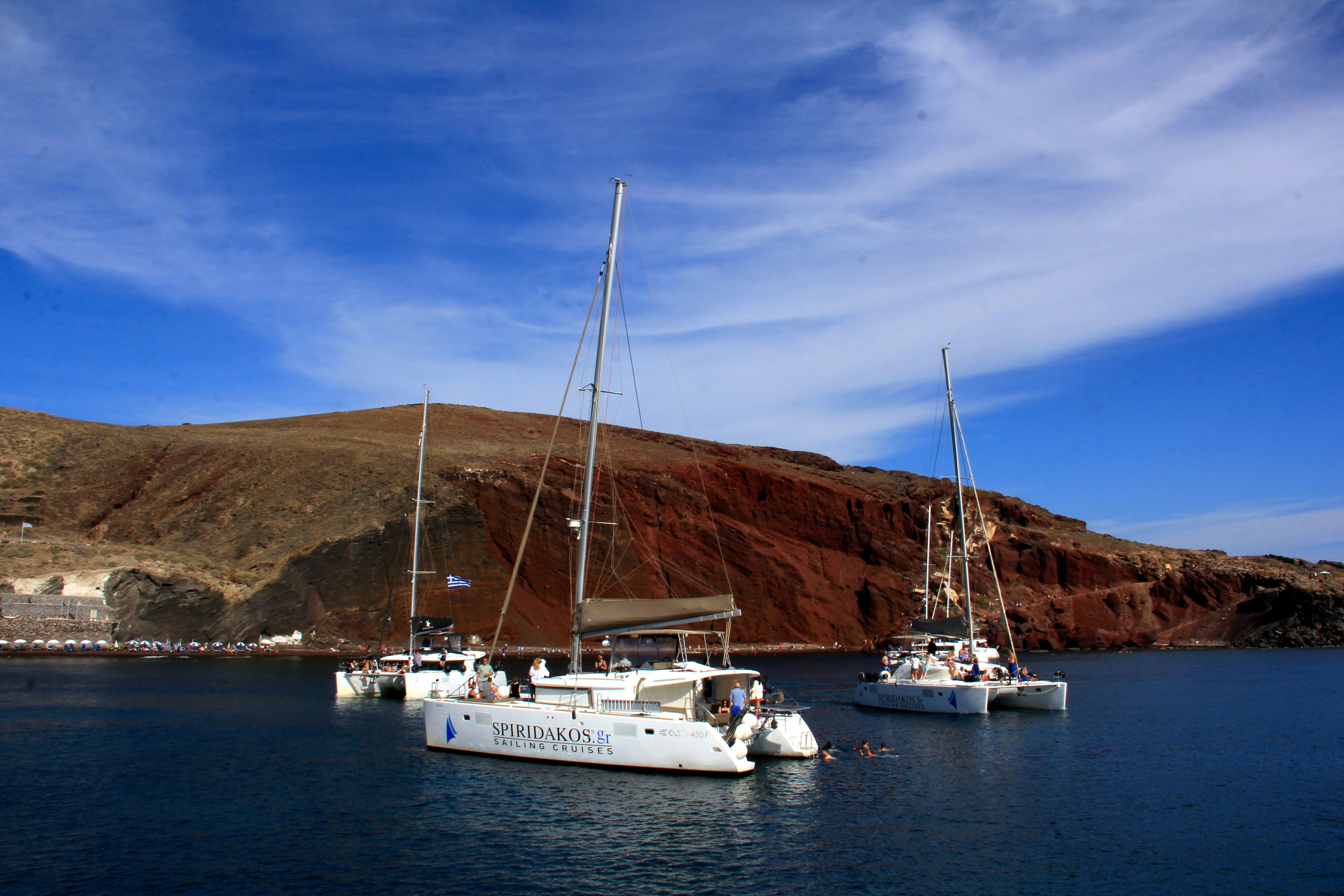 Catamaran sailing at sunset with snorkelers in Red Sea