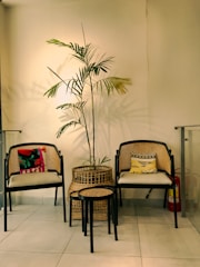 Comfortable seating area with cushions and a small table in Deluxe Room.