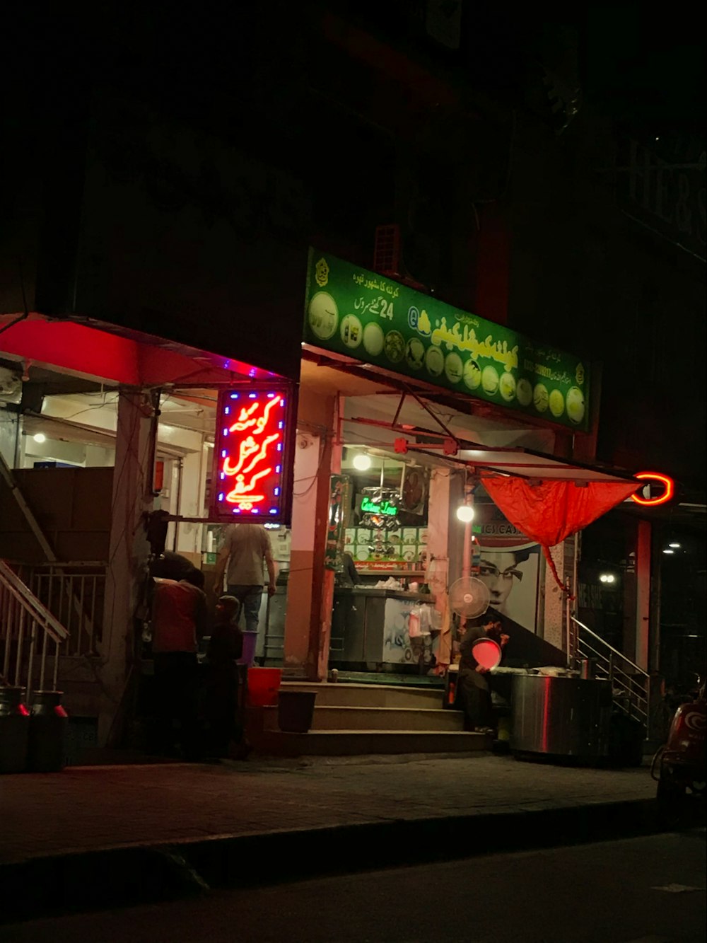 a restaurant with neon signs