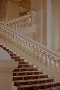 a staircase with white pillars