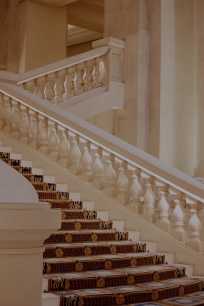 a staircase with white pillars