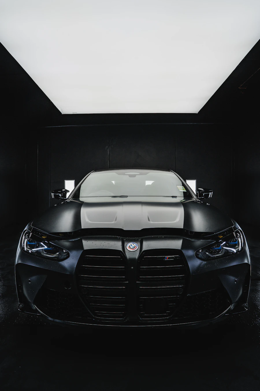 Black sports car detailed in a studio setting