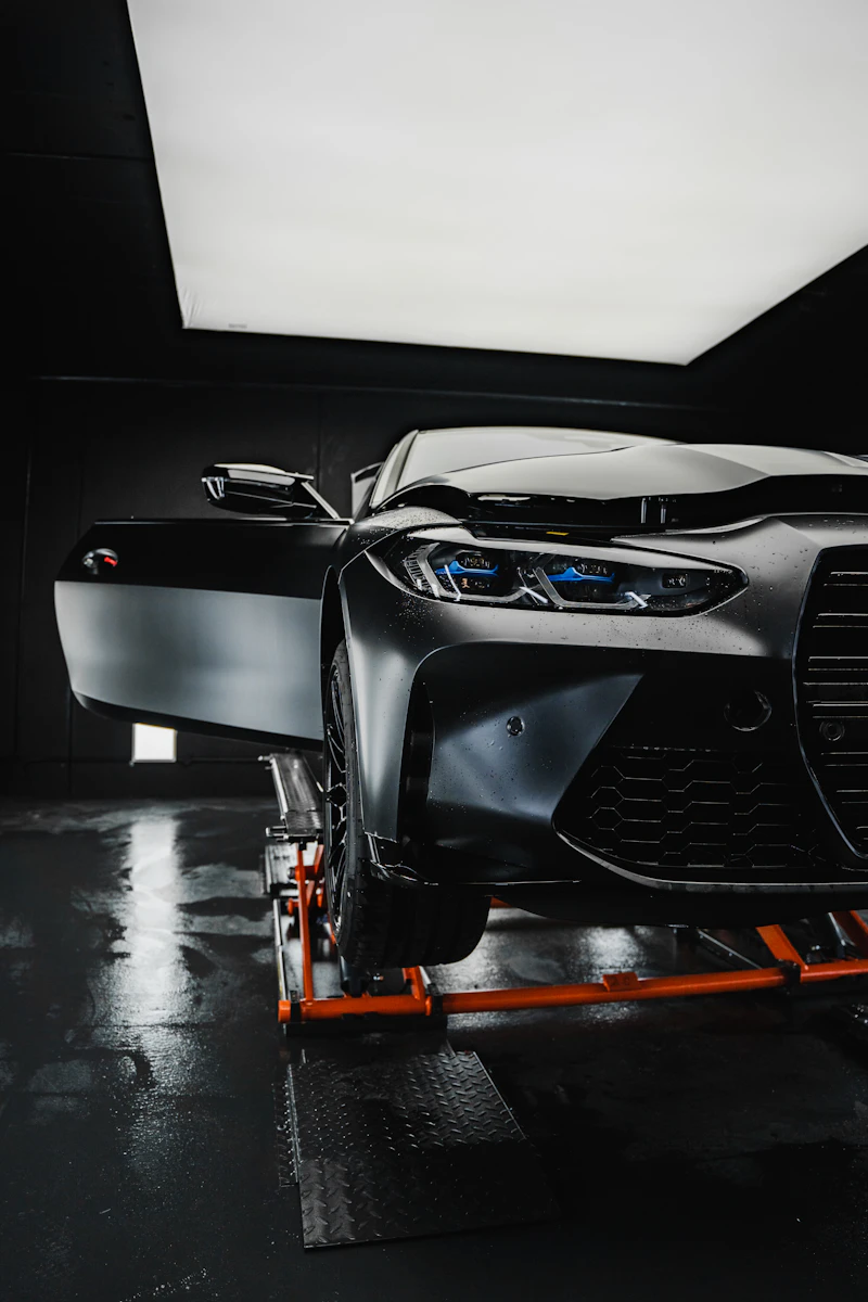 BMW M4 staged in the bay before a dyno pull