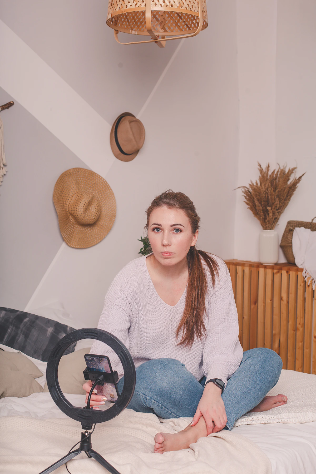 Content creator filming themselves with a ring light setup