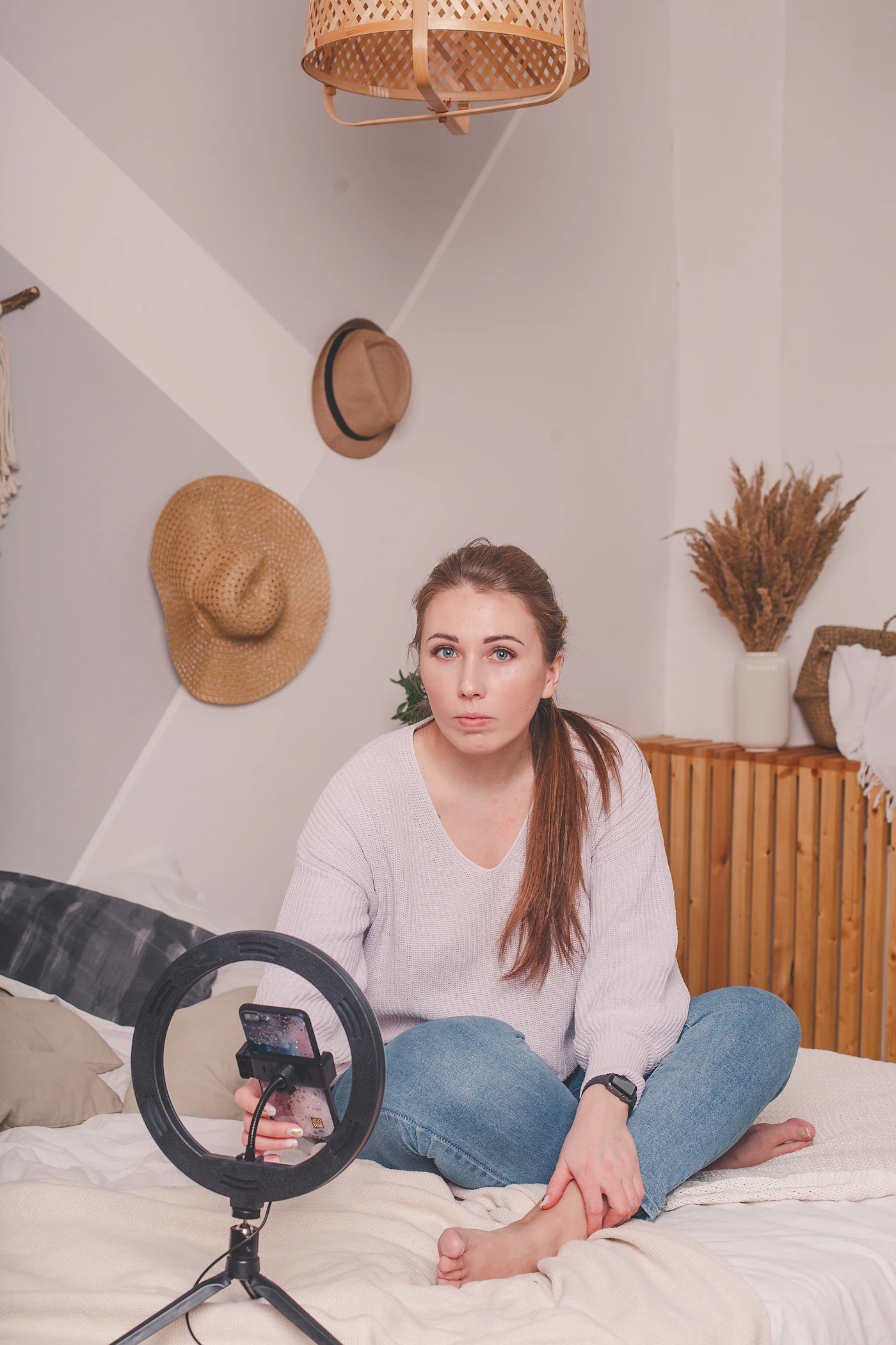 Content creator filming themselves with a ring light setup