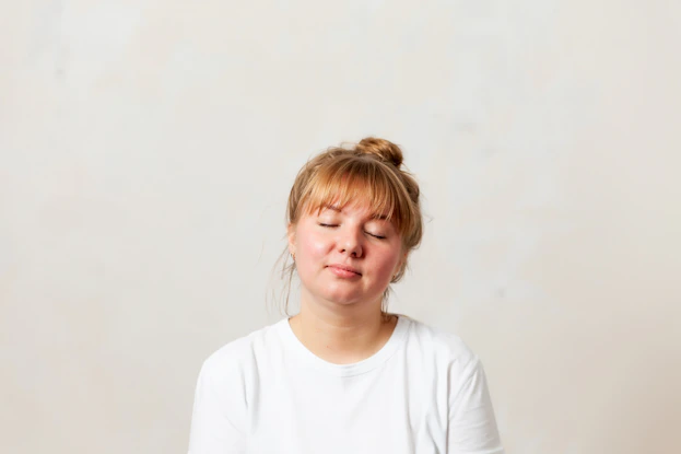 a girl with her eyes closed