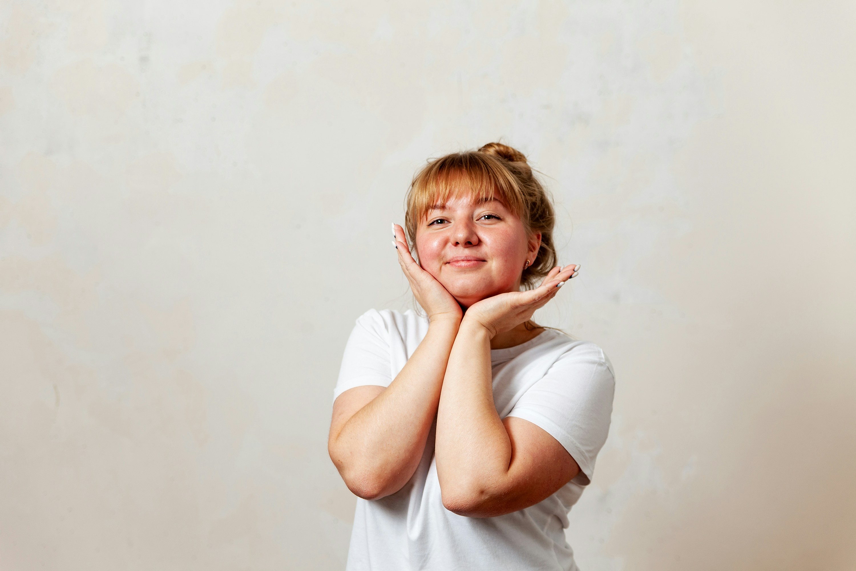 a person with the hands on the face