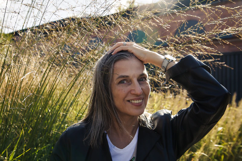 a woman with her hand on her head