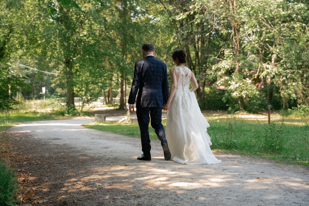 a man and woman walking down a road