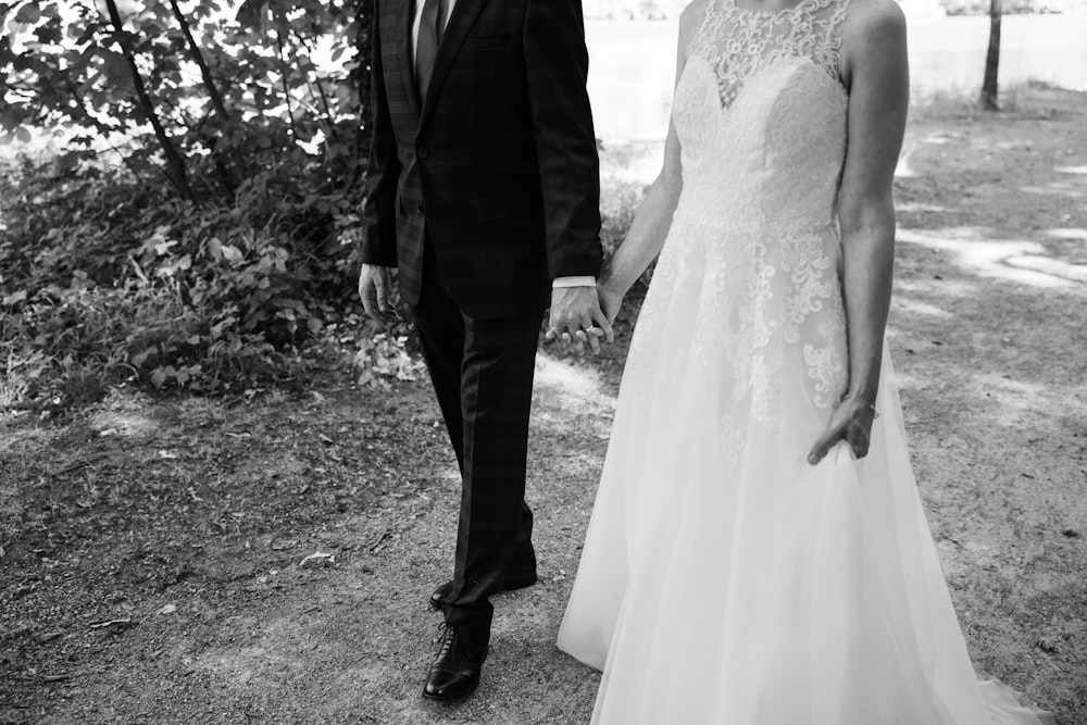 a man and woman walking down a path