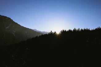 A serene sunrise over a quiet mountain, symbolizing spiritual awakening and discovery.