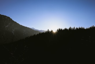 A tranquil sunrise over a peaceful mountain landscape.