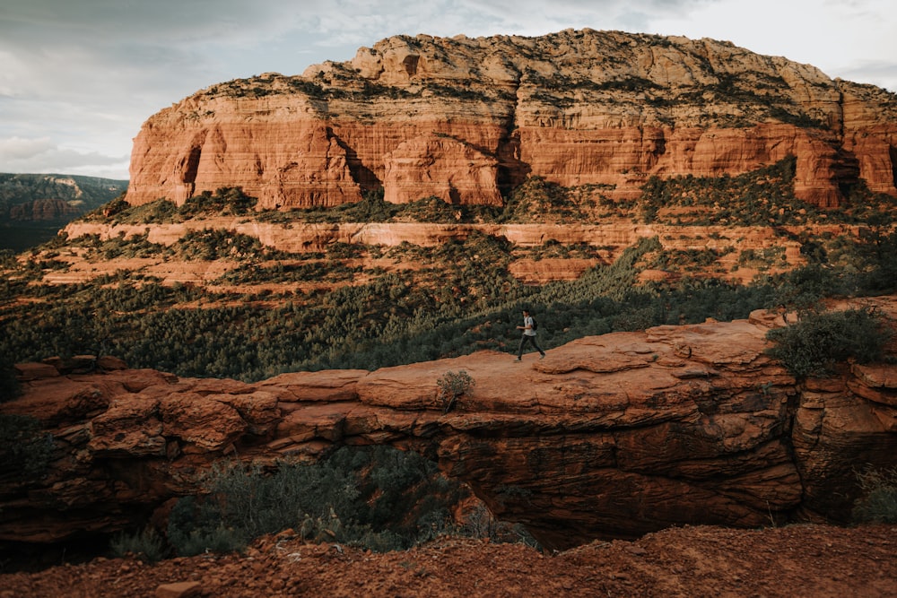 a person standing on a rock