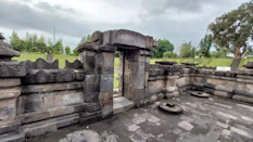 a stone structure with a stone wall