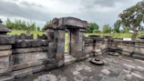 a stone structure with a stone wall