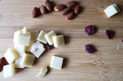 Fresh ingredients like almonds and berries spread on a wooden table.