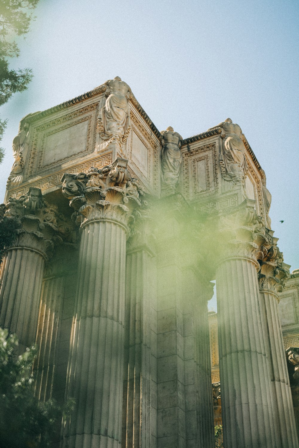 a large stone building with statues