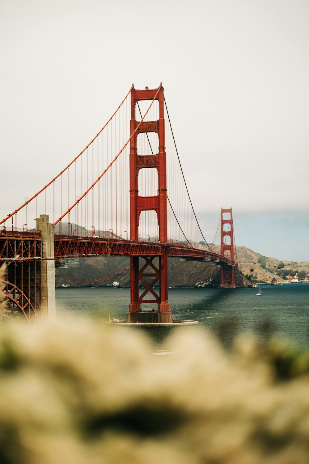 a large red bridge over water