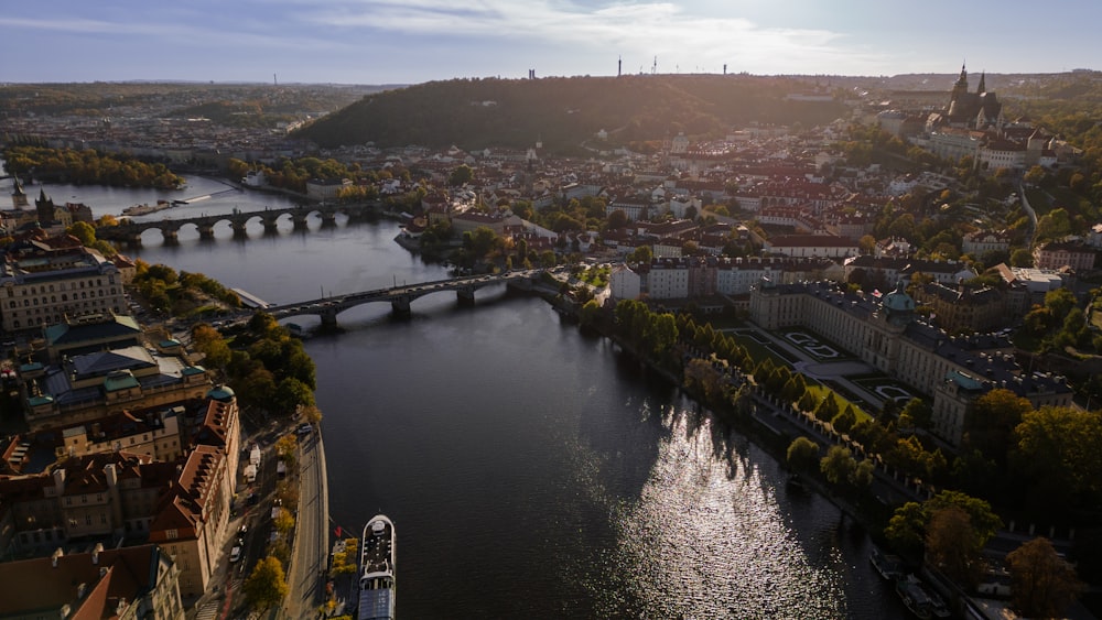 a river with a bridge and buildings