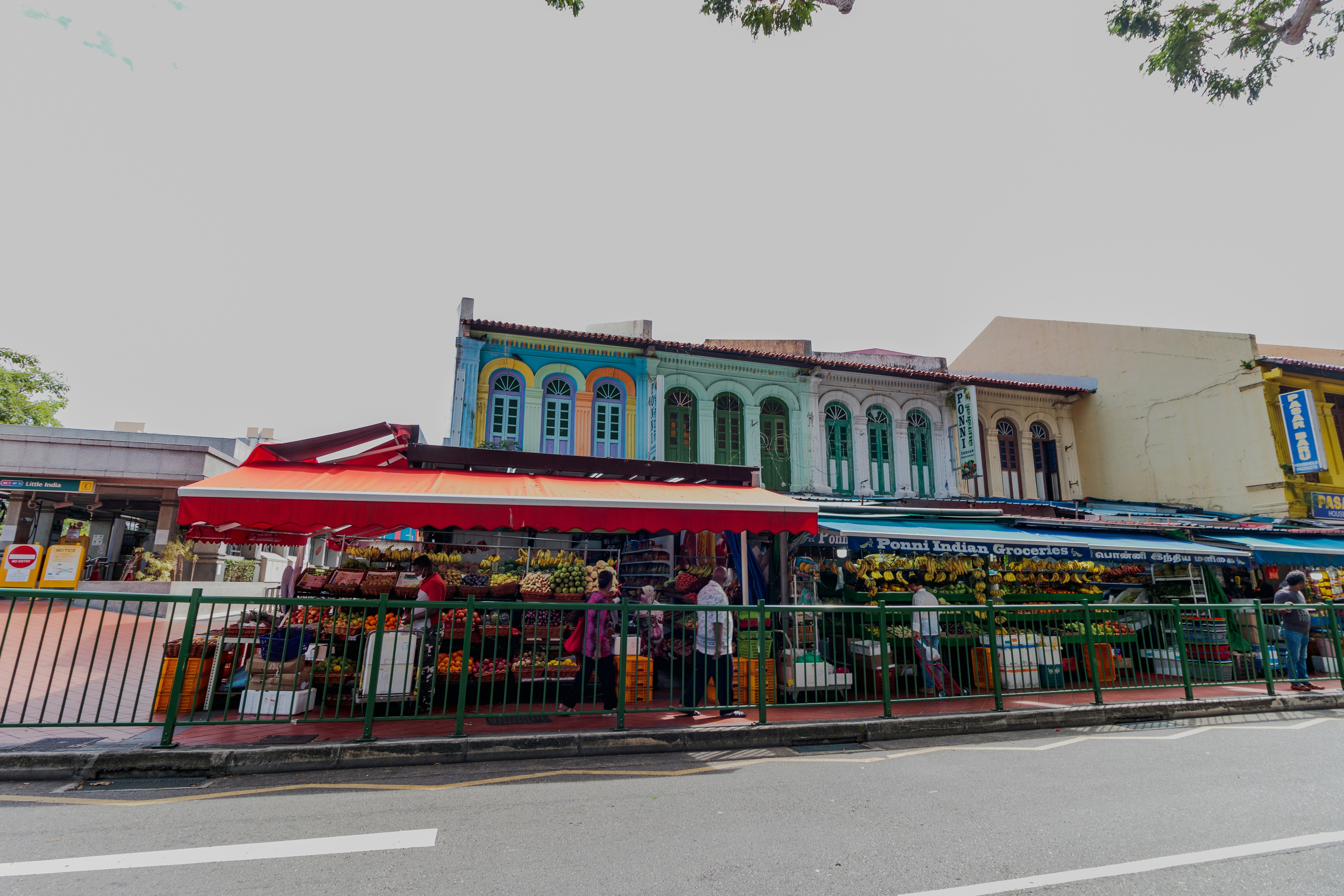 a colorful building with a fence around it, 