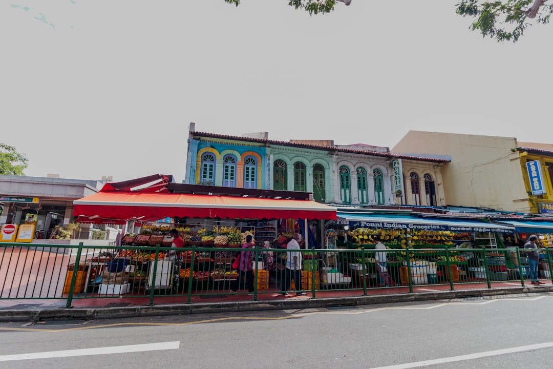 a colorful building with a fence around it,