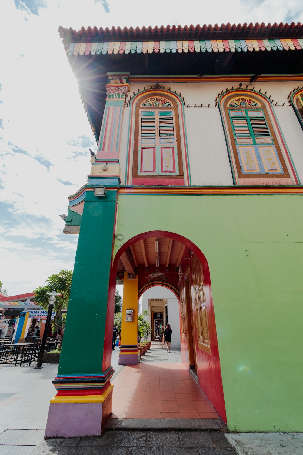 a colorful building with a red roof