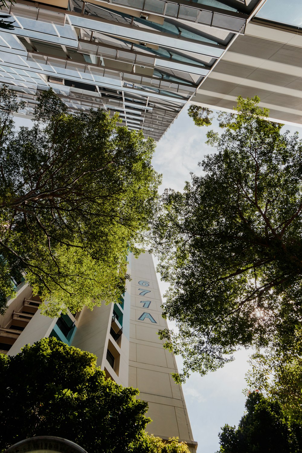 a tall building with trees in front of it