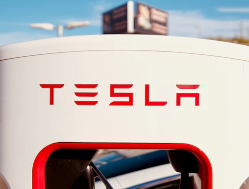 Public dual-head Type 2 charging station installed outdoors with clear branding