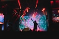 a person on a stage with lights