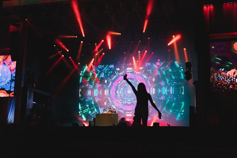 a person on a stage with lights