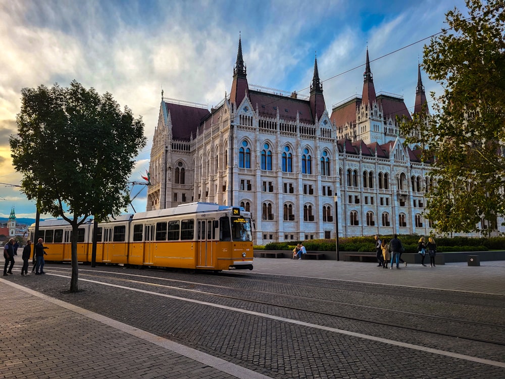 a yellow train on the tracks