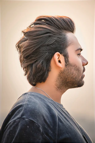 Modern hairstyle with clean lines styled in a sleek, masculine look.