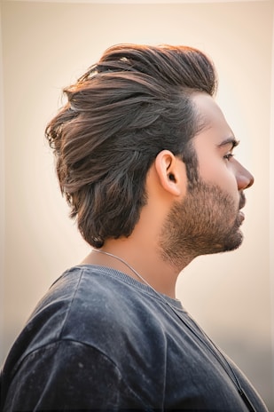 Side profile of a patient highlighting dense hair restoration after treatment.