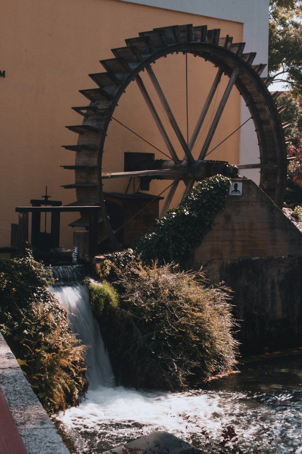 a water wheel with a waterfall