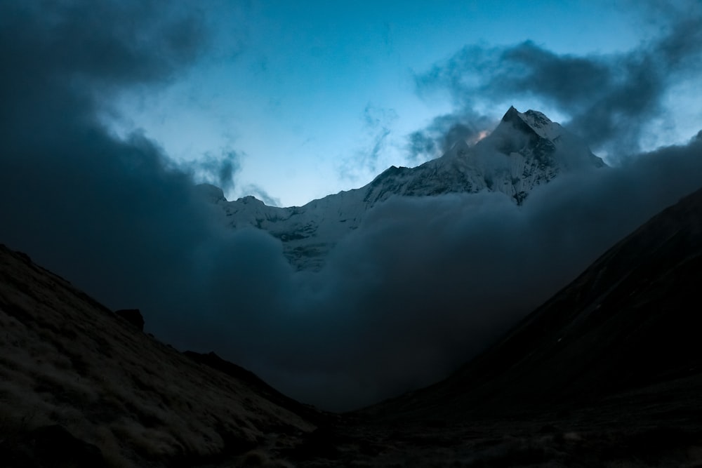 a mountain with clouds