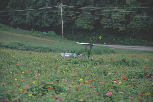Close-up of Yuka Mini 2 robot mower navigating smoothly around garden flower beds
