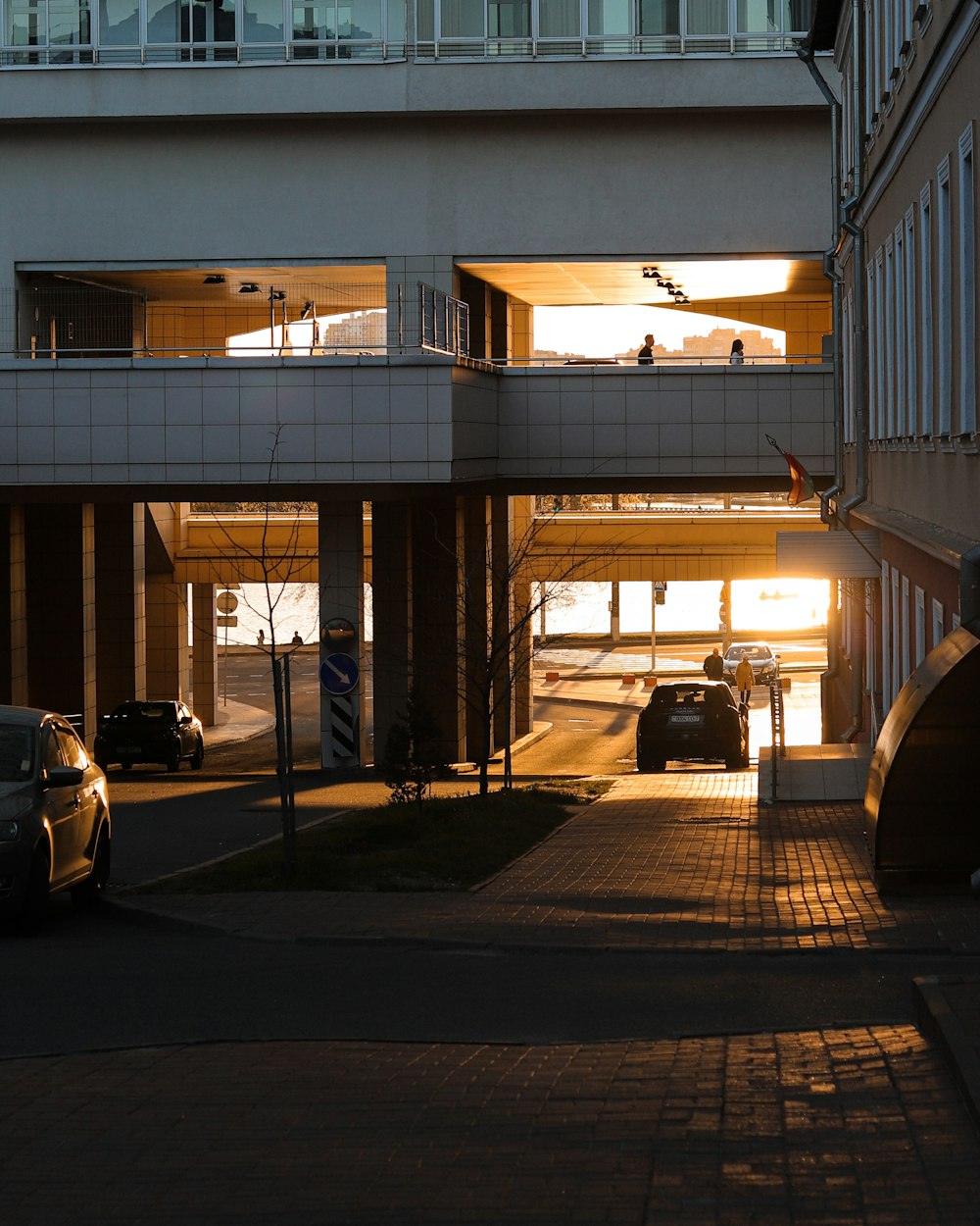 a street with cars and buildings