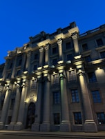 Evening shot of a public building illuminated, showcasing the quality and detail of the construction.