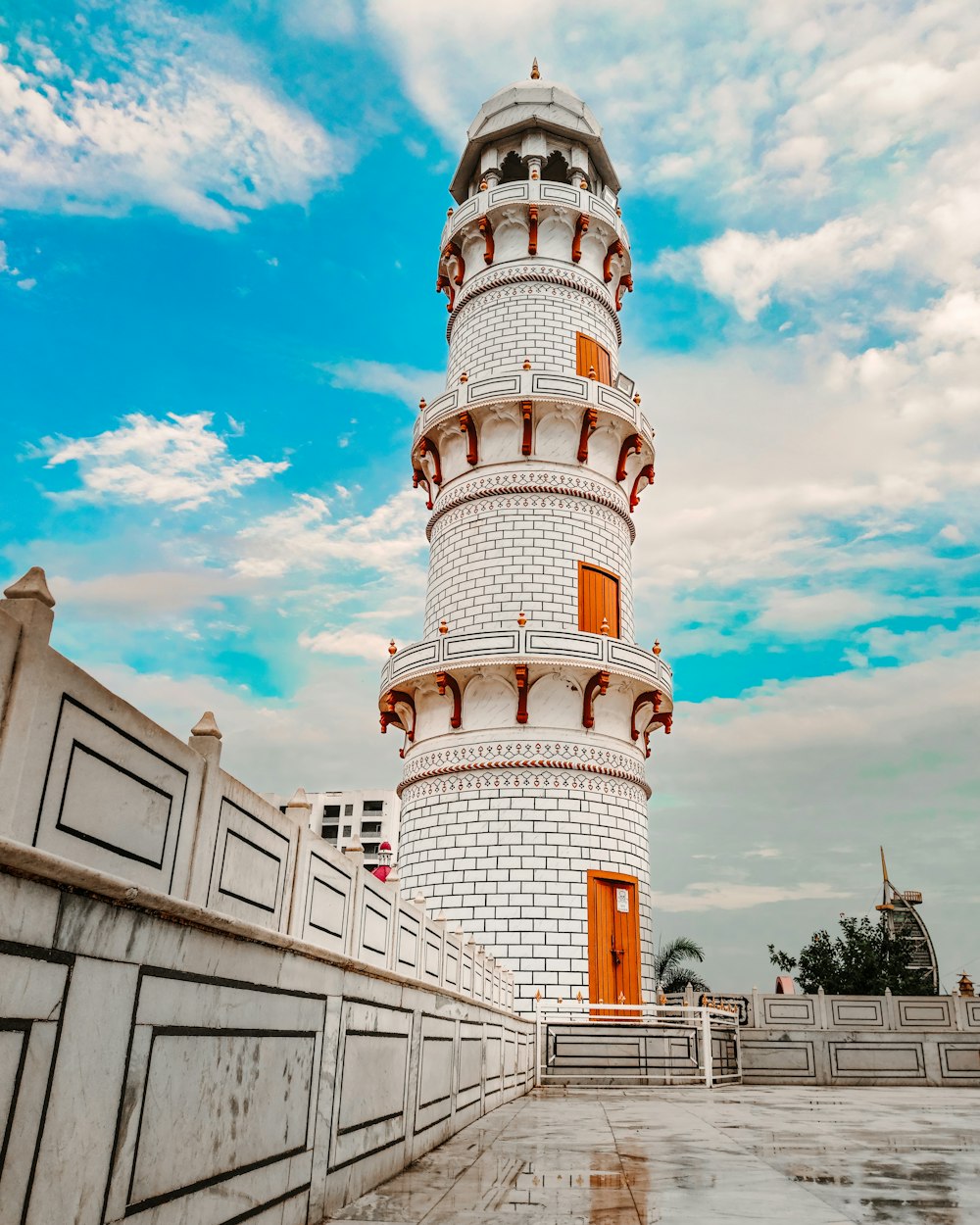 a white tower with a white top