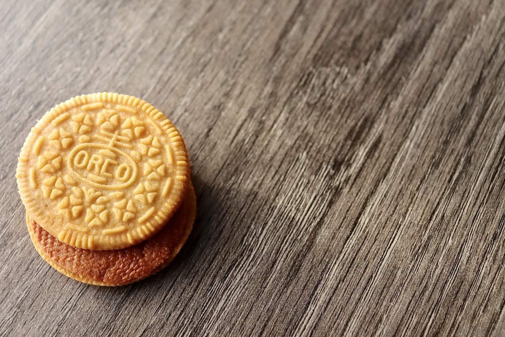 a cookie next to a coin
